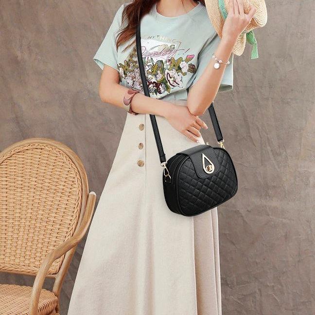 sac noir tendance à fermoir doré