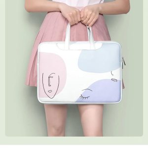 sac bandoulière ordinateur visage abstrait